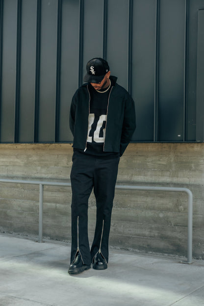 Black Denim QTR Zip Flare Pants with flared leg and quarter-zip detailing for men’s streetwear.

